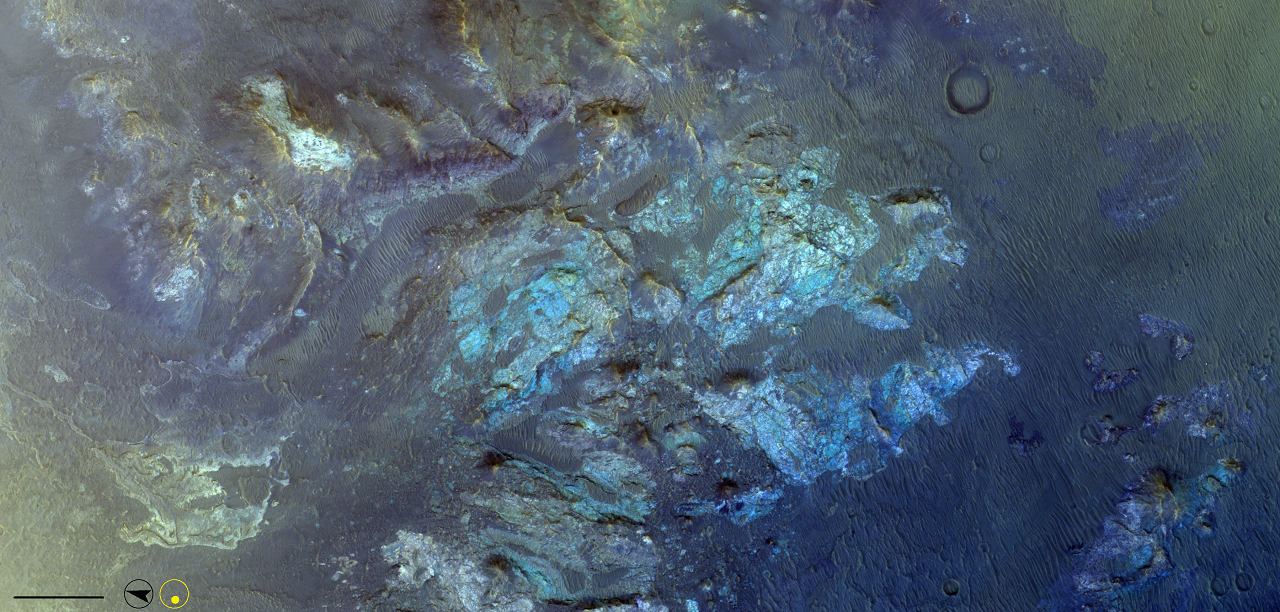 The central peak of this crater that lies south-east of Huygens crater on the westmost side of Tyrrhena Terra. The greenish coloured material is heavily fractured. There are parallel dune structures surrounding the uplift on most sides. There are also some exposures of lighter-toned material to the north.